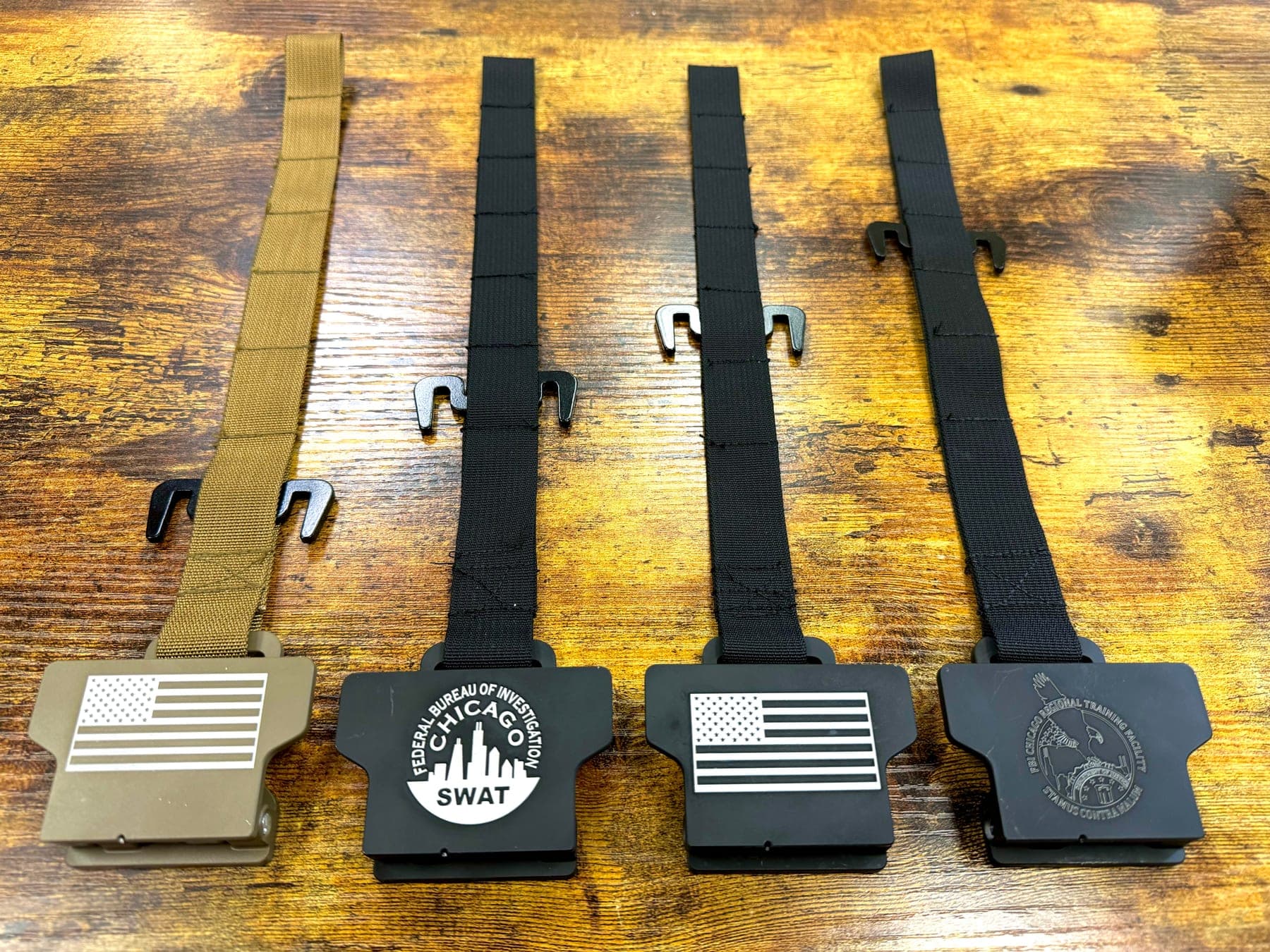 Law Weapons Tactical Shield Hooks — tan with American flag, FBI Chicago SWAT, black with American flag, FBI Chicago Regional Training Facility custom engraving